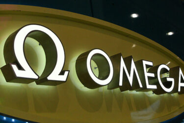 Retail Store - Omega Watches- Face Lit & Halo Lit Channel Letters - Storefront Sign - Illuminated Sign - Aluminum - LED - Outdoor Sign - Wall Sign - Building Sign