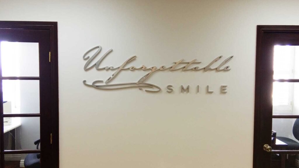 DENTAL OFFICE - UNFORGETTABLE SMILE - CORPORATE IDENTITY - RECEPTION AREA SIGN - LOBBY SIGN - CHROME ALUMINUM LETTERS - INTERIOR SIGN