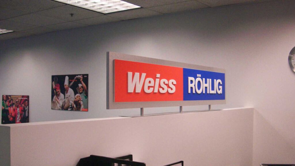 REALTY OFFICE - WEISS ROHLIG - CORPORATE IDENTITY - DIMENSIONAL LETTERS - RECEPTION AREA SIGN - LOBBY SIGN - ACRYLIC - INTERIOR SIGN